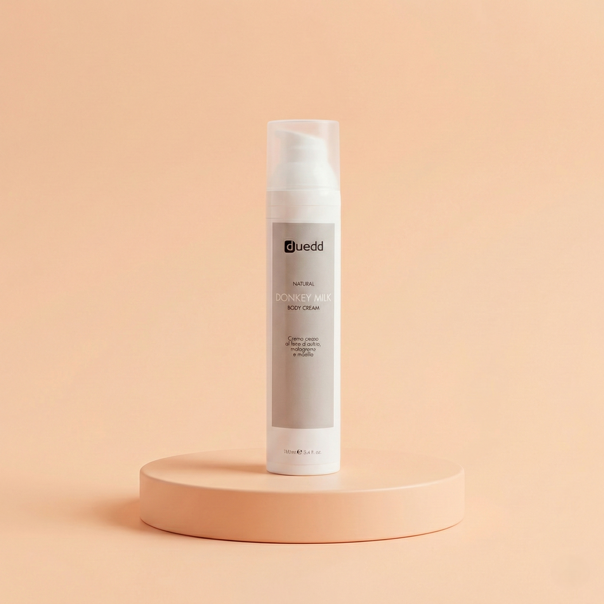 Flacone da 100ml di Natural Donkey Milk Body Cream DUEDD, crema corpo al latte d'asina bio, melograno e mirtillo, azione lenitiva e anti-psoriasi